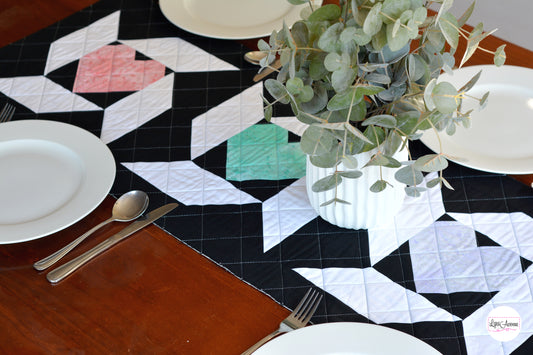 Image showing a table runner in black white, pink, green and purple