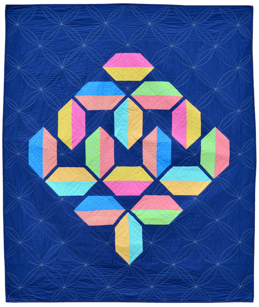 Flourishing quilt pattern in scrappy colours pink, peach, yellow, blue, green and lime on a navy blue background