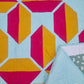 Flourishing quilt in two colour version of red and yellow on a light green background