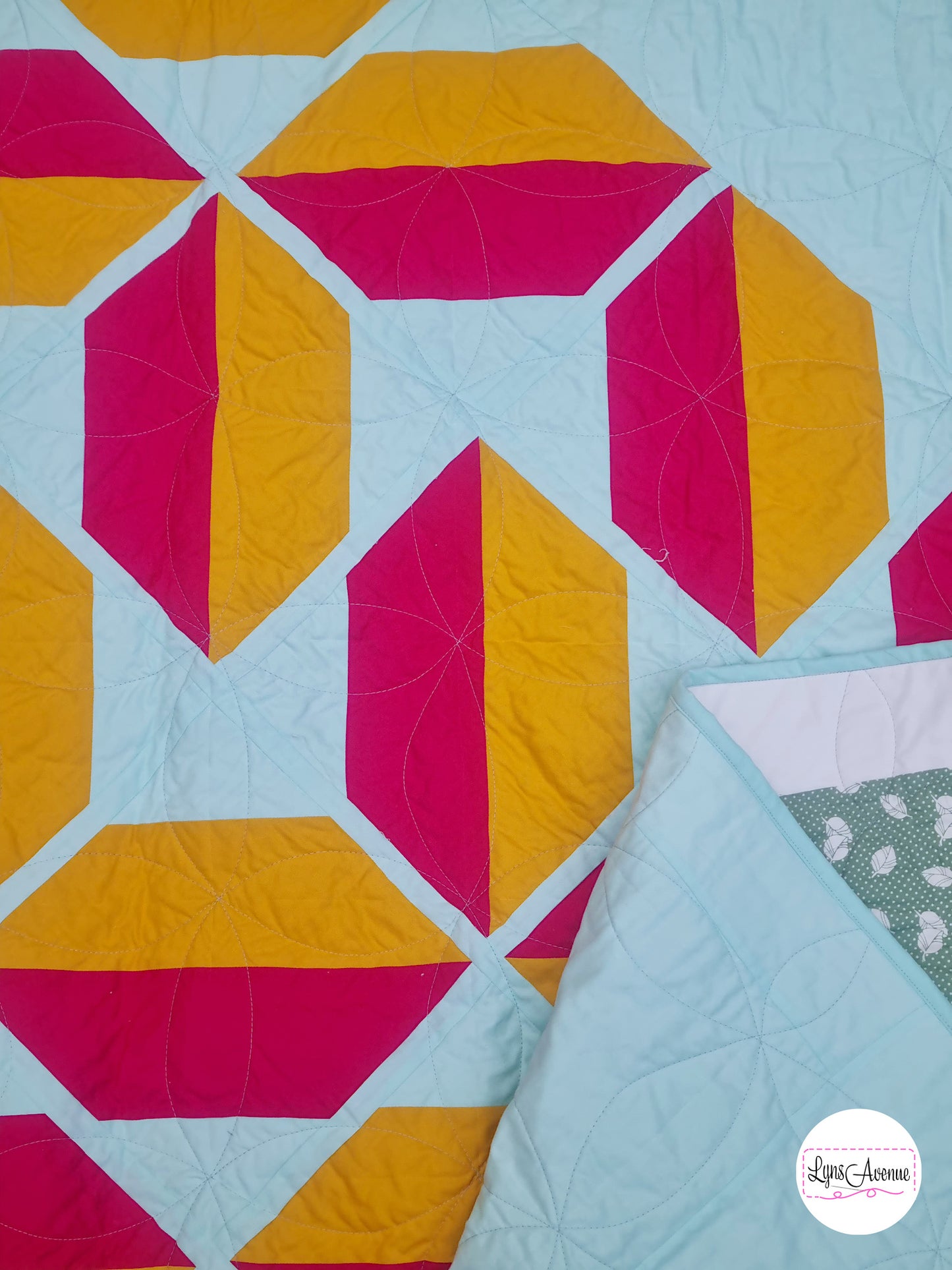 Flourishing quilt in two colour version of red and yellow on a light green background